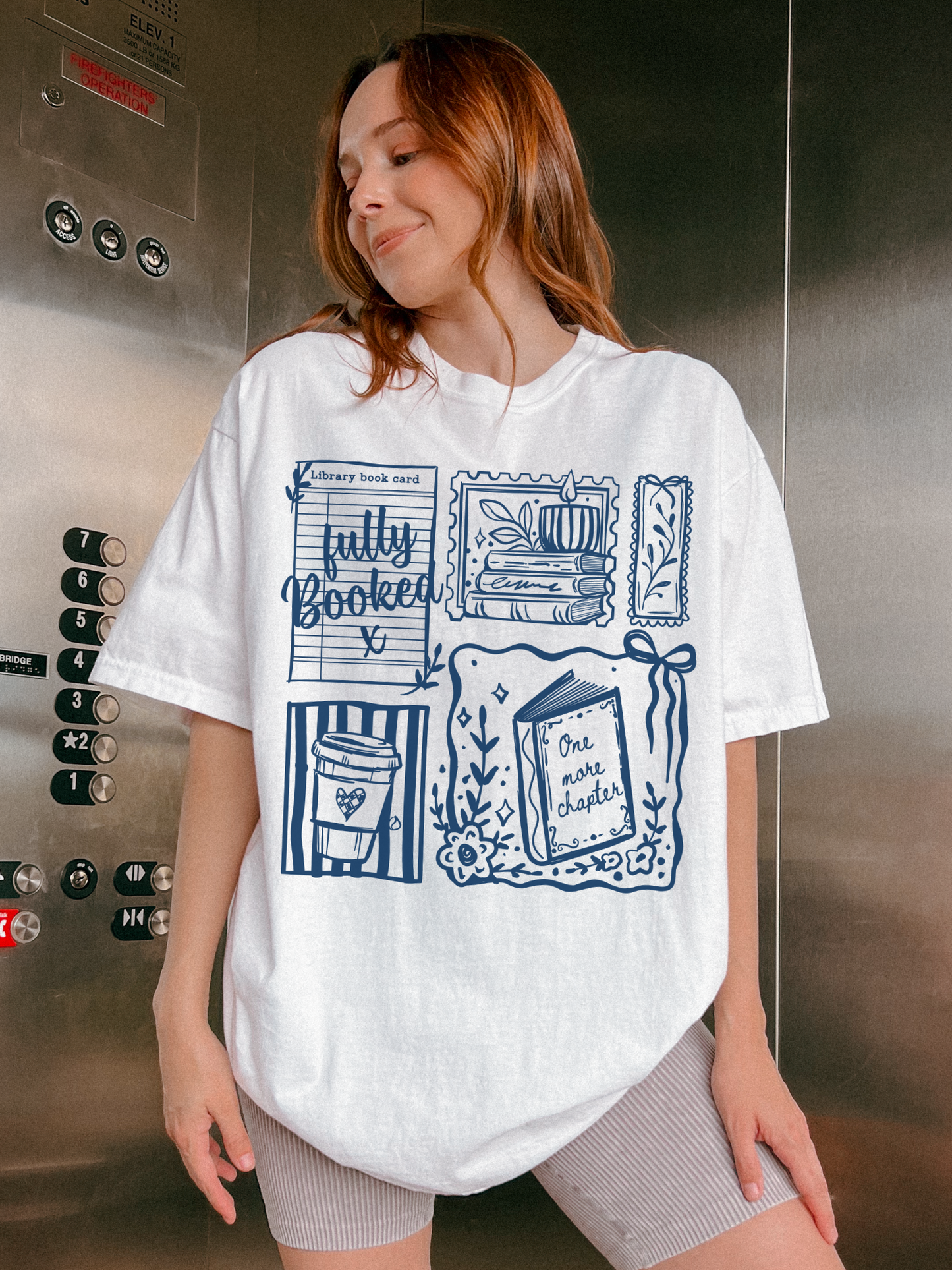 woman wearing white fully booked book lover t shirt posing in elevator with casual outfit and reading themed graphic design