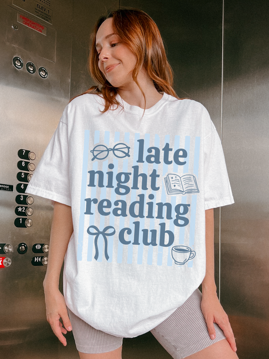 woman posing in elevator wearing late night reading club white t shirt with book lover design and blue stripe background graphic