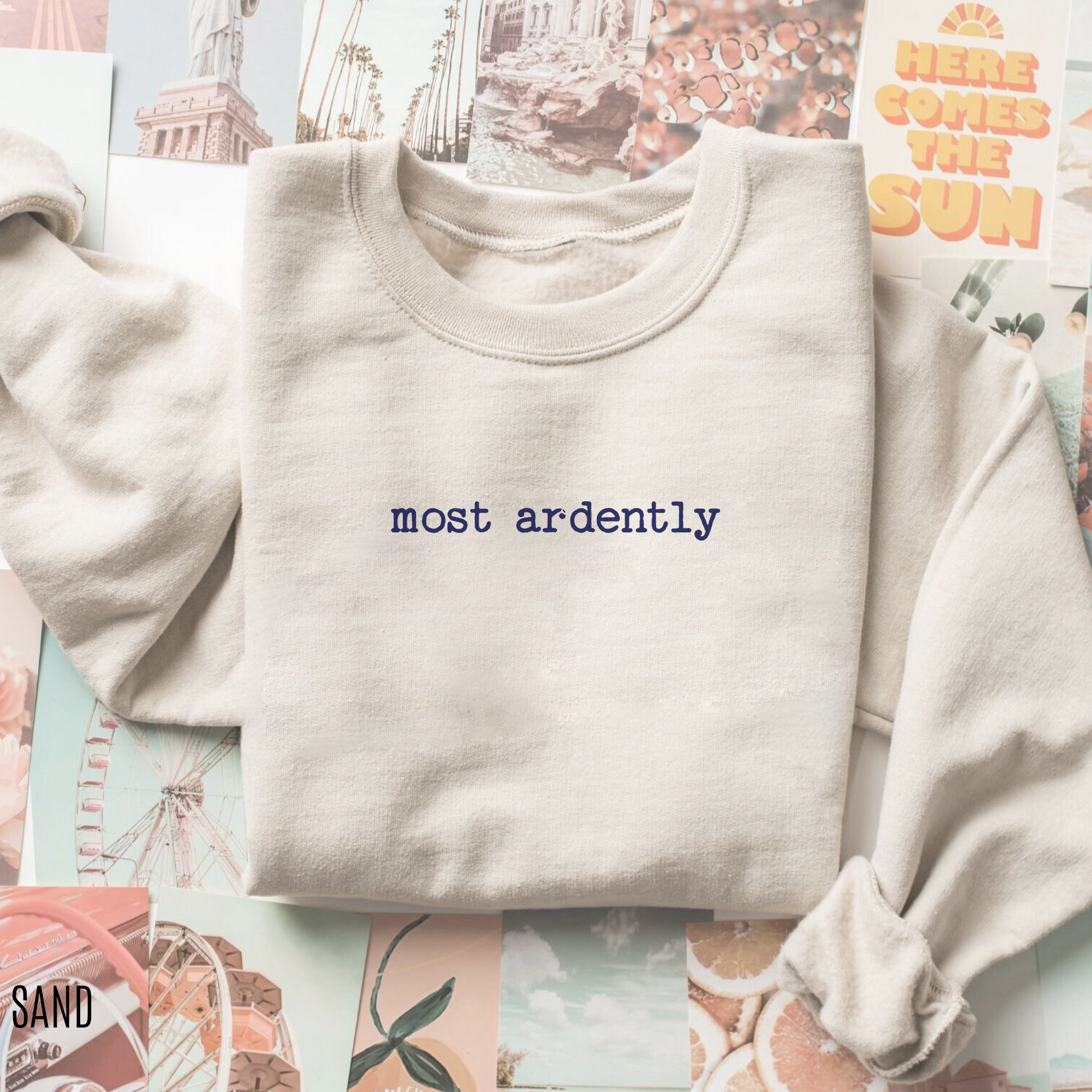 folded sand sweatshirt with minimalist most ardently quote styled on pastel photo background