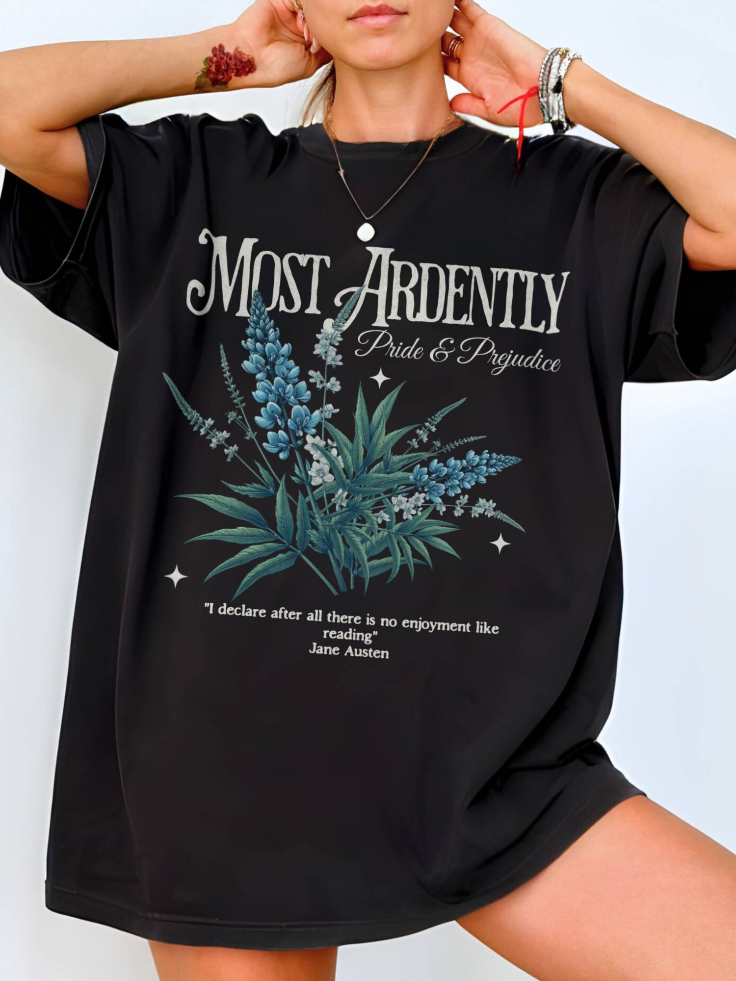 woman wearing oversized black Most Ardently t-shirt with floral design and Jane Austen quote
