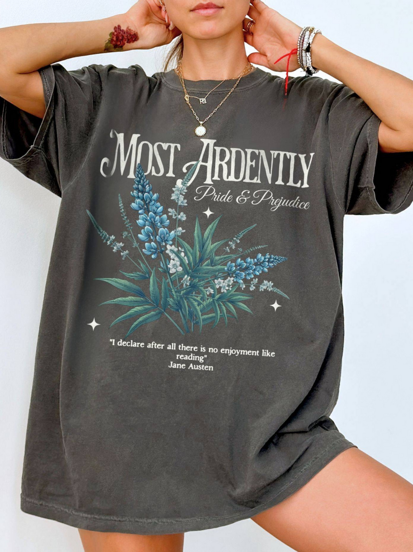 woman wearing a pepper Most Ardently t-shirt with romantic blue floral print and reading quote