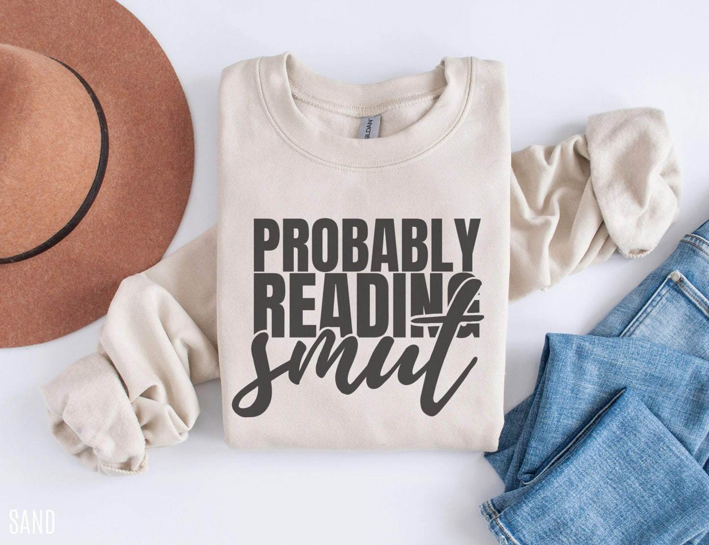 sand Probably Reading Smut sweatshirt with rolled sleeves styled with jeans and felt hat