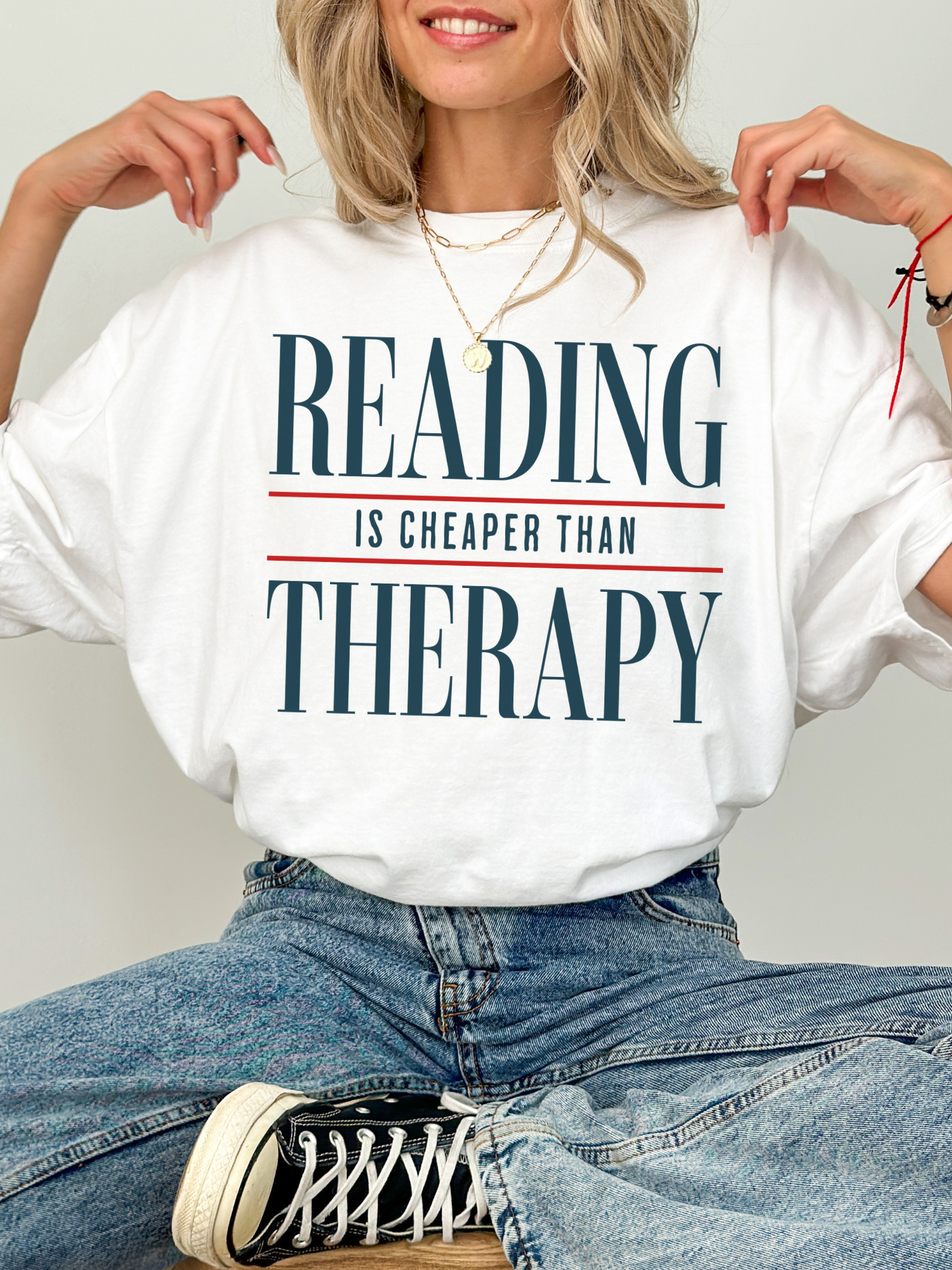 white comfort colors reading is cheaper than therapy shirt with clean typography design for readers and book lovers