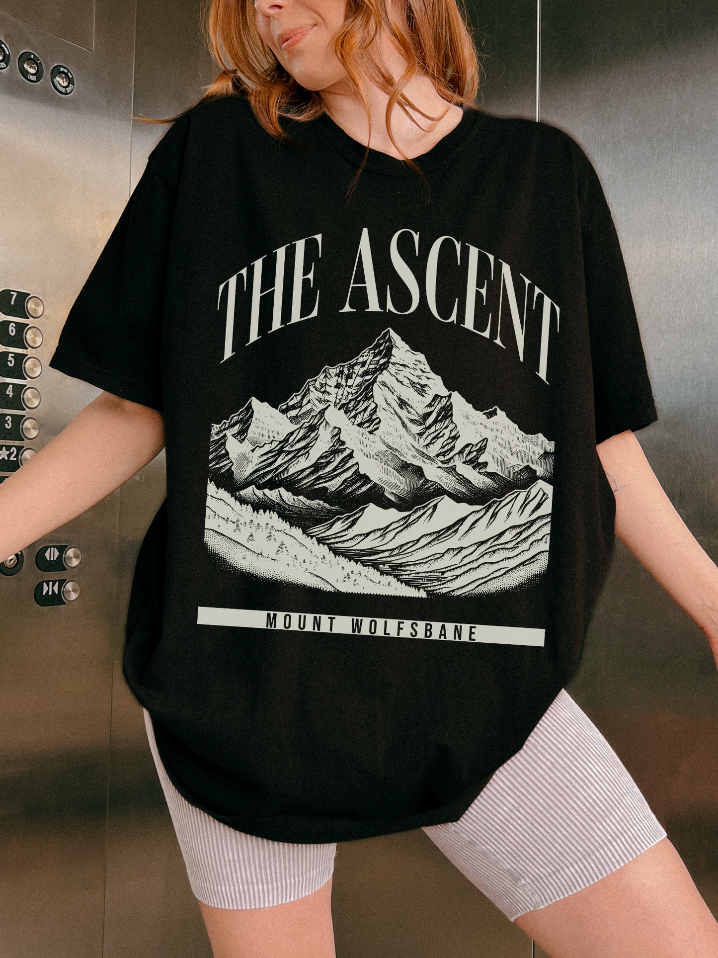black oversized t shirt featuring The Ascent Mount Wolfsbane mountain landscape fantasy inspired graphic print