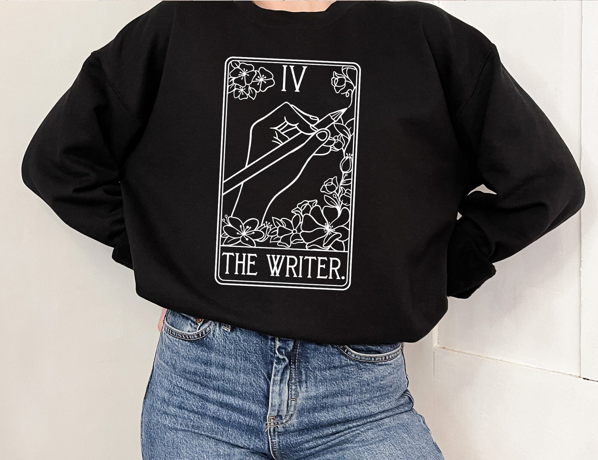 black crewneck sweatshirt with minimalist white tarot card design and The Writer caption