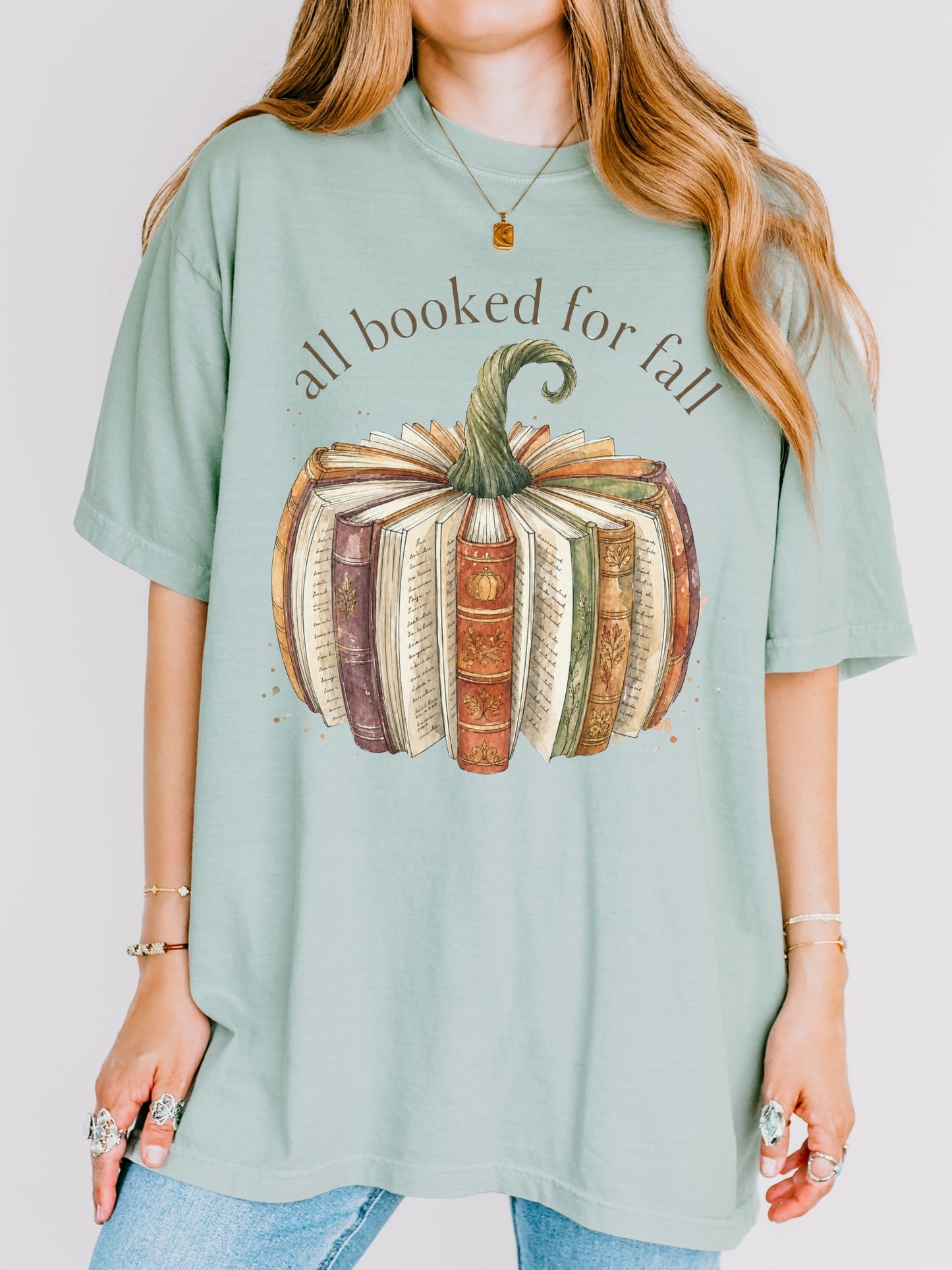 All Booked for Fall bookish pumpkin Comfort Colors shirt in Bay featuring vintage books and autumn reading design