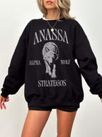 black crewneck sweatshirt featuring Anassa Alpha Wolf Strategos fantasy wolf graphic design for fantasy book lovers