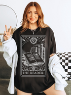 Woman modeling The Reader shirt in black with cozy cardigan, styled as casual book lover outfit
