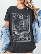 Woman modeling The Reader shirt in dark grey with cozy jean cardigan, styled as casual book lover outfit