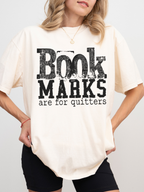 ivory comfort colors book marks are for quitters graphic tee with distressed black text for cozy book lovers