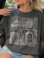 A woman wearing a dark gray graphic t-shirt with white illustrations of books, a coffee cup, and text reading 'fully Booked' and 'One more chapter'.