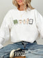 Gildan bookish reader sweatshirt featuring cute book, coffee, candle, bookmark and e-reader illustration in White
