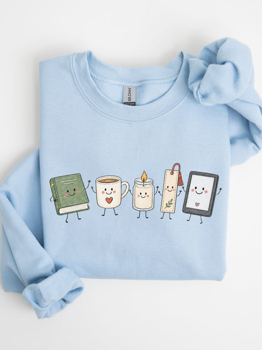 Gildan bookish sweatshirt with cute book, coffee mug, candle, bookmark and e-reader illustration in Light Blue