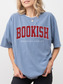 woman wearing blue Comfort Colors shirt that says Bookish Reading Addict in red varsity letters