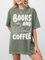 woman wearing a moss Comfort Colors shirt featuring a books and coffee graphic with a steaming coffee mug, stacked books, and open novel illustration, oversized reading shirt for book lovers