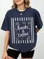 navy comfort colors oversized books and coffee shirt featuring book stack coffee cup and reading inspired graphics