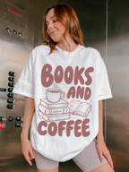 woman wearing a white Comfort Colors shirt featuring a books and coffee graphic with illustrated books and a steaming coffee cup, styled in an elevator setting for a cozy bookish aesthetic