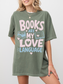 woman wearing a moss comfort colors t shirt featuring books are my love language graphic with stacked books open book illustration and pastel lettering for reading enthusiasts