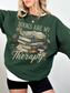forest green books are my therapy sweatshirt featuring distressed books floral art and takeaway coffee cup