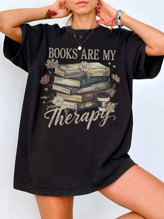 Black Books Are My Therapy Comfort Colors T-shirt styled with layered gold jewelry and minimal background