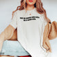 woman wearing ivory shirt that says buy me books and call me a good girl with cardigan and jeans