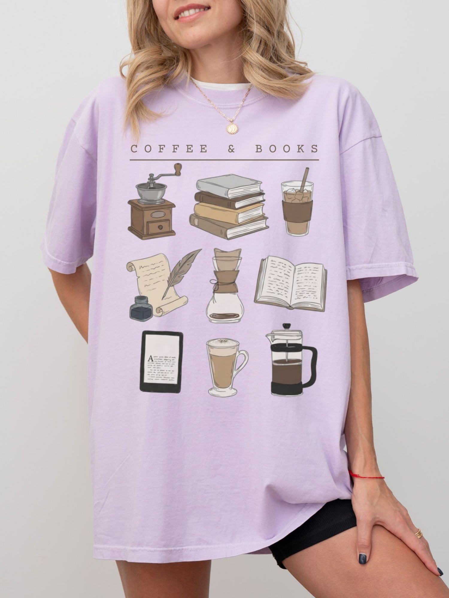model in orchid reading t-shirt with coffee and books graphic design