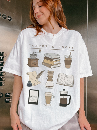 red-haired woman in elevator wearing white book and coffee tee with stack of books and iced coffee