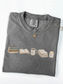 Folded pepper Comfort Colors reading shirt with books, Just One More Chapter mug, blanket and candle design
