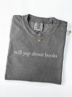 Folded Pepper Comfort Colors shirt with will yap about books text styled with necklace on a clean white background