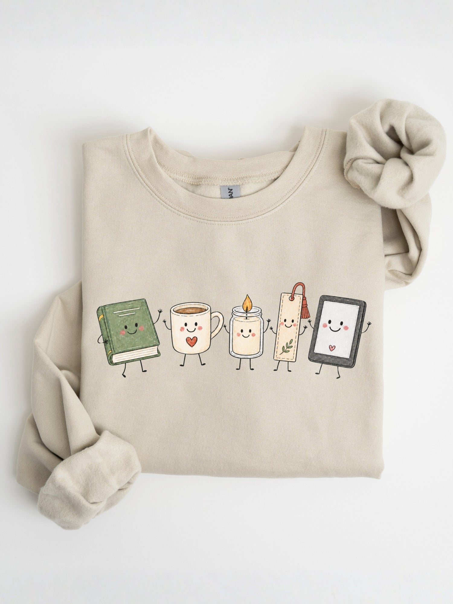 Gildan book lover sweatshirt with cute book, coffee mug, candle, bookmark and e-reader characters in Sand