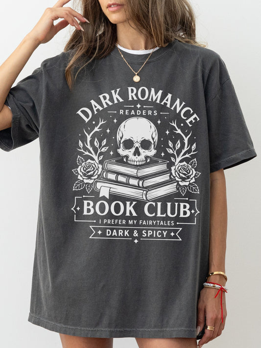 Model wearing a Pepper Comfort Colors bookish shirt with Dark Romance Readers Book Club design featuring a skull, stacked books and roses for dark romance book lovers
