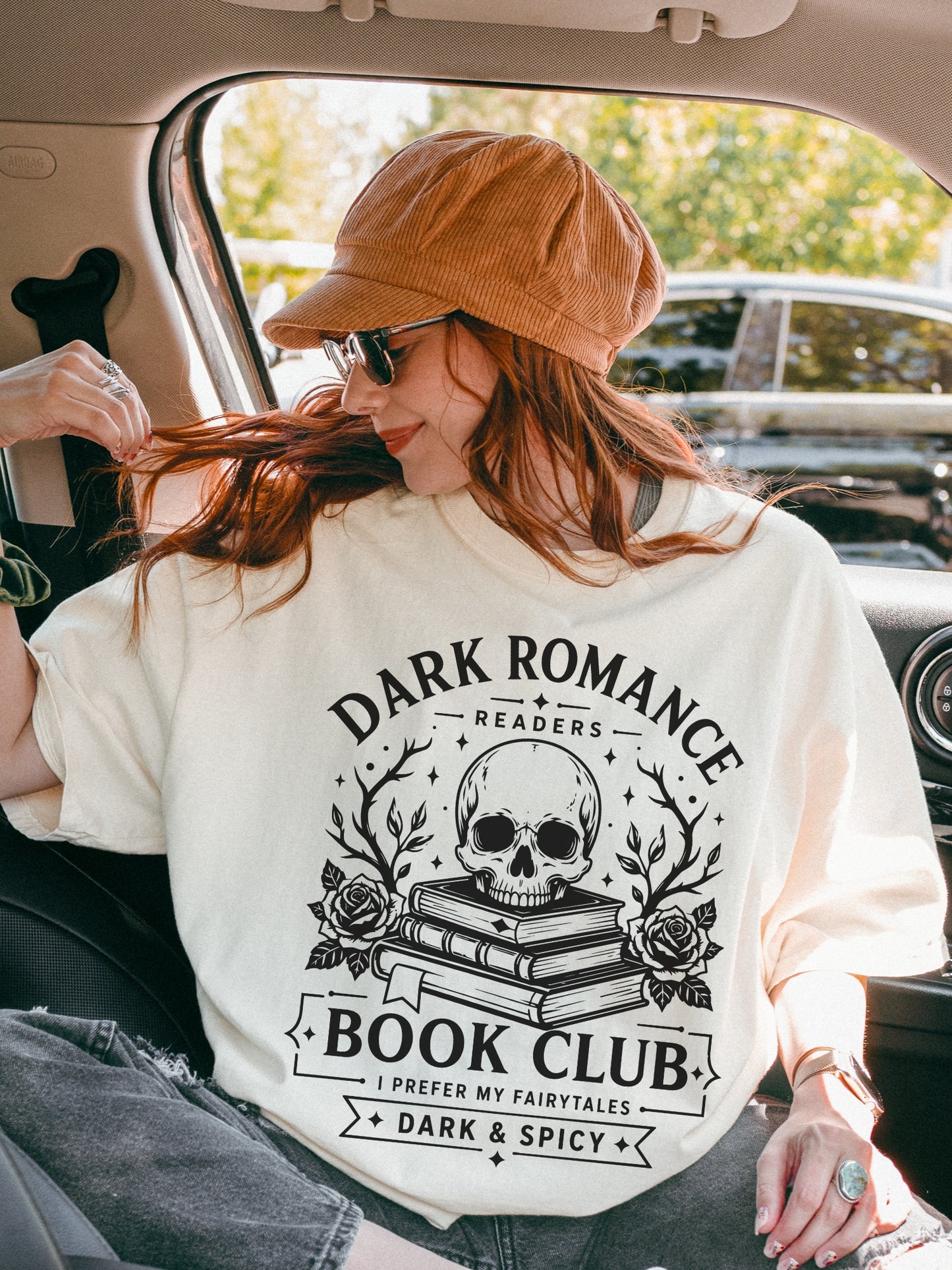Model wearing an Ivory Comfort Colors bookish shirt with Dark Romance Readers Book Club graphic featuring a skull, stacked books and roses for dark romance lovers