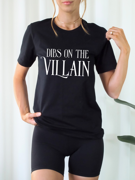woman wearing fitted black Dibs on the Villain t-shirt and black shorts in minimalist room