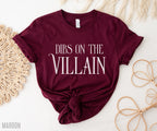flat lay of maroon Dibs on the Villain t-shirt with knotted hem and soft bookish styling