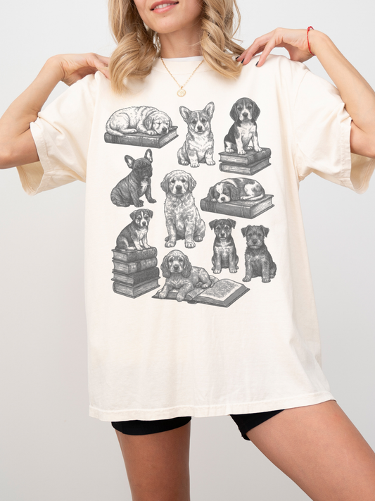 woman modeling cream t-shirt with vintage dog and book illustration, perfect for dog lovers who enjoy reading and cottagecore fashion