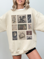 Woman wearing sand oversized sweatshirt with fantasy themed postage stamp artwork including dragon antique books moon floral illustrations and castle aesthetic