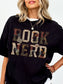 Black Comfort Colors shirt modeled with a vintage floral Book Nerd graphic featuring book pages, flowers and butterflies, bookish t shirt for readers and book lovers