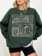 woman wearing dark green fully booked book lover sweatshirt with vintage reading illustrations relaxed oversized cozy outfit