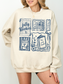 woman wearing sand fully booked book lover sweatshirt with vintage book themed illustrations oversized cozy style