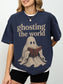 Model wearing a Navy Comfort Colors bookish shirt with Ghosting the World quote and vintage ghost reading a book graphic
