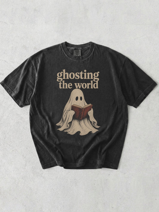Graphite Comfort Colors bookish shirt with Ghosting the World text and vintage ghost reading a book graphic for readers and book lovers