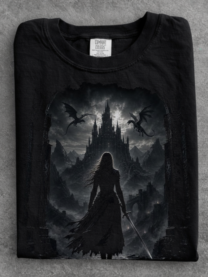 folded black comfort colors gothic fantasy castle shirt featuring female warrior, dragons, and medieval castle artwork
