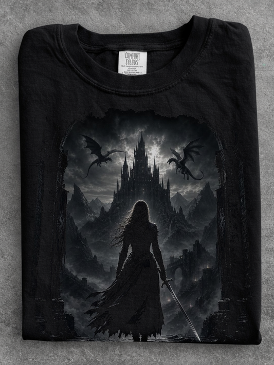 folded black comfort colors gothic fantasy castle shirt featuring female warrior, dragons, and medieval castle artwork