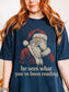 True Navy Comfort Colors shirt featuring vintage Santa covering his eyes and he sees what you’ve been reading text, a funny Christmas shirt for book lovers and readers
