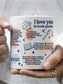 Woman holding white ceramic mug featuring romantic fantasy book quotes and illustrations including dragon, book, pen and stars on glossy coffee cup