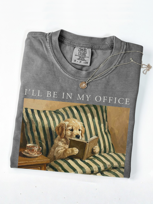 pepper comfort colors shirt folded with dog reading book graphic vintage style cozy reading aesthetic with necklace detail minimalist product photo