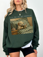 forest green crewneck sweatshirt with dog reading book design cozy book lover aesthetic oversized fit casual outfit styling
