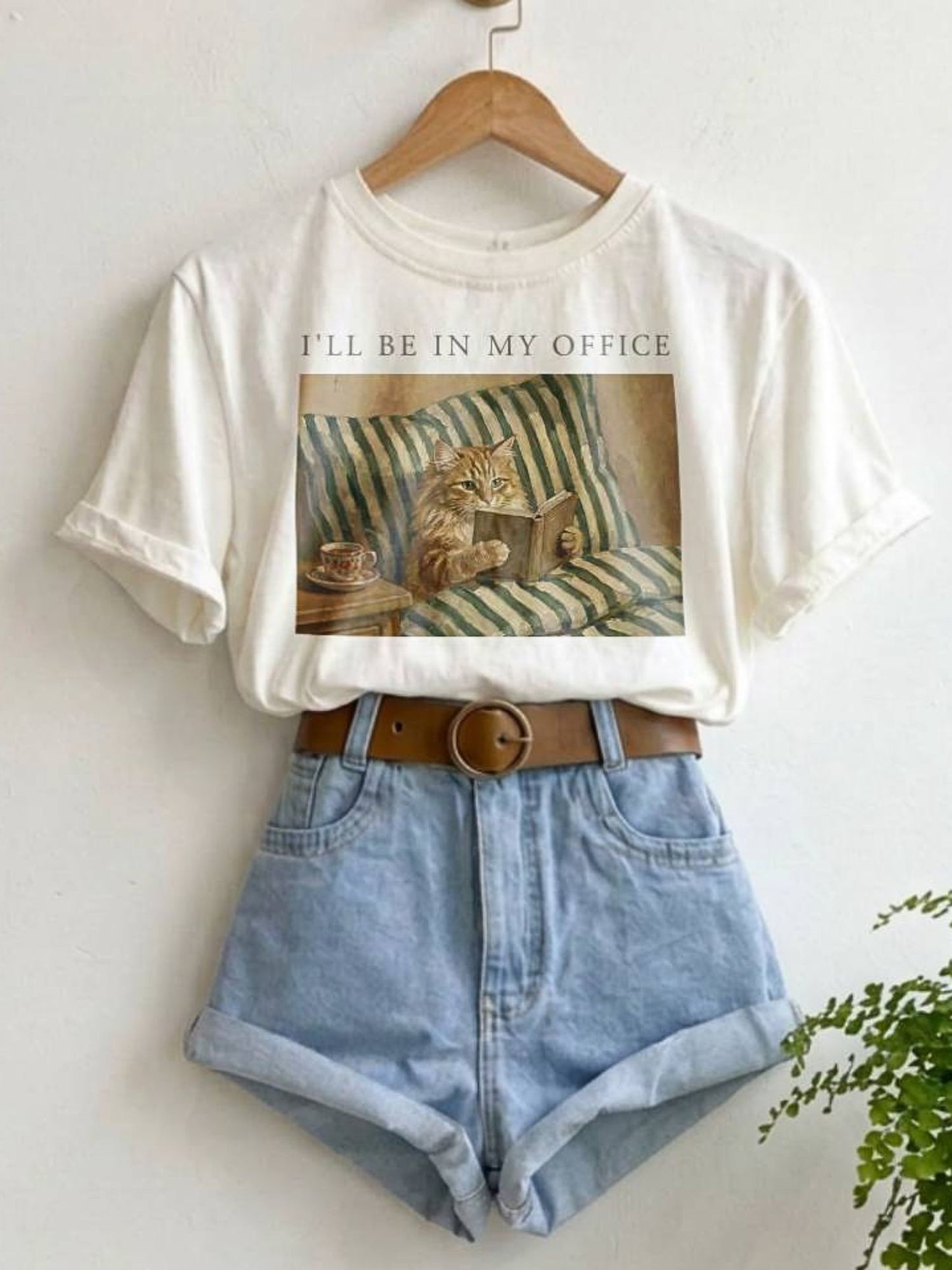 hanging white shirt with text that says "ill be in my office" with a vintage image of a cat reading in bed