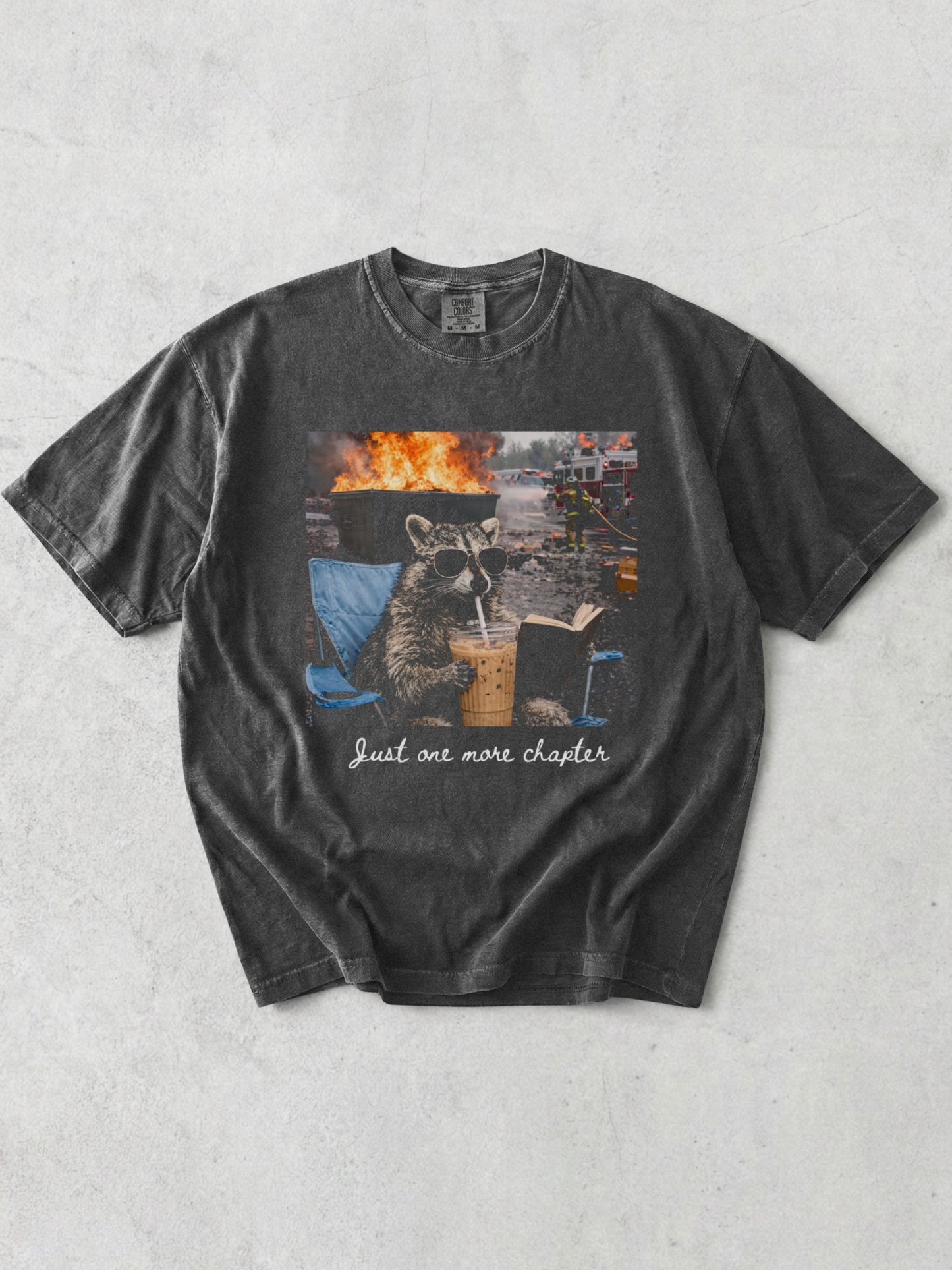 pepper comfort colors raccoon just one more chapter shirt with funny reading graphic iced coffee and fire background design