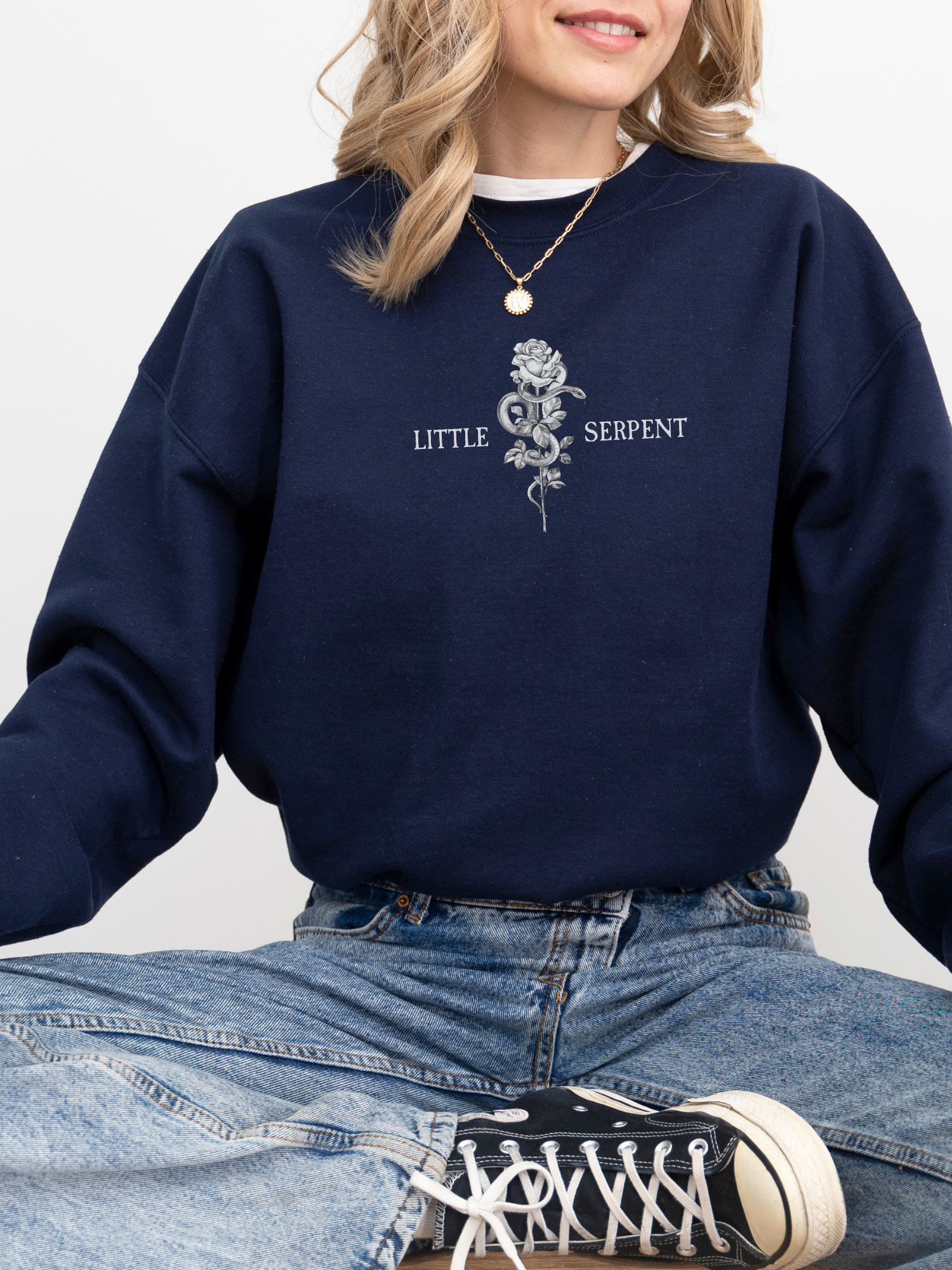 Navy blue sweatshirt featuring centered Little Serpent chest print design with rose and snake, inspired by Oraya of the Nightborn from Carissa Broadbent’s Crowns of Nyaxia series